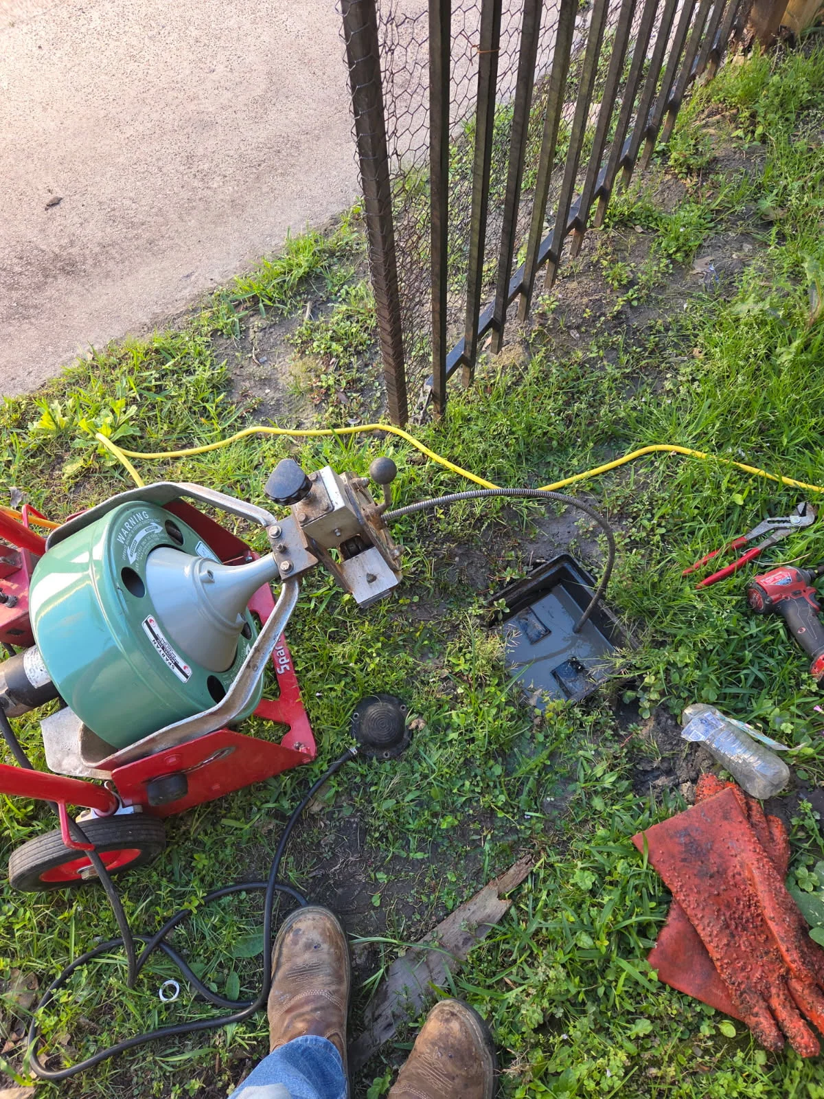 Professional plumber working on residential plumbing system